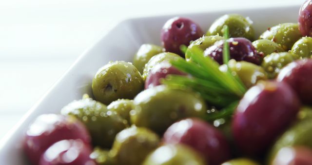 Colorful Assorted Olives with Rosemary in White Dish - Download Free Stock Images Pikwizard.com