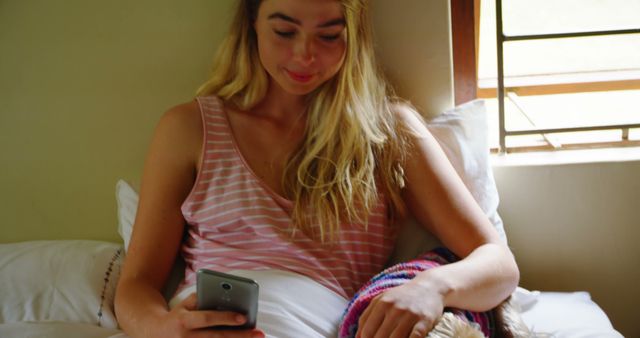 Woman Relaxing in Bed While Using Smartphone - Download Free Stock Images Pikwizard.com