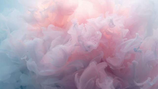 Ethereal Pastel Ink Clouds Swirling in Liquid Creating Soft Pink and Blue Gradient Veils