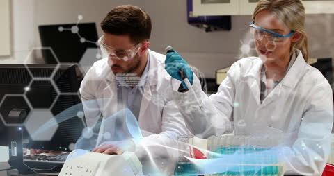 Scientists Analyzing Data in Laboratory With Digital Interface