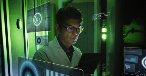 Asian Technician Analyzing Data on Digital Interface in Server Room - Download Free Stock Images Pikwizard.com