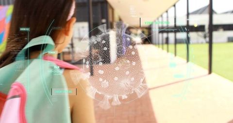 Digital Overlay of Coronavirus Over Schoolgirl Walking in School Hallway