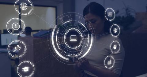 Asian businesswoman interacting with holographic UI on smartphone in modern office