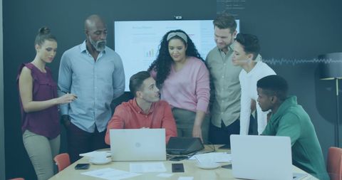 Diverse Team Collaborating Over Business Presentation with Data Insights - Download Free Stock Images Pikwizard.com