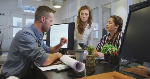 Modern Office Team Collaborating on Project with Digital Devices