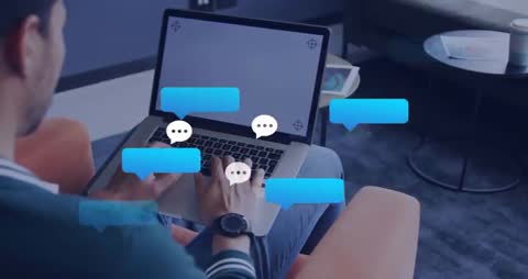 Man Using Laptop with Floating Digital Chat Bubbles