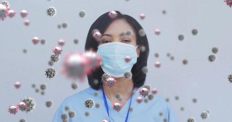 Healthcare professional facing covid-19 virus particles