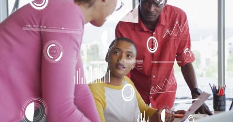 Team Analyzing Data with Technology Overlay in Office