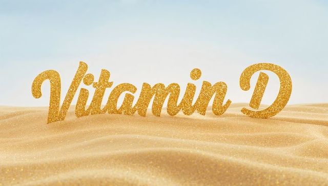 Golden glitter vitamin d script sparkling over sunlit sand dunes for sunshine branding
