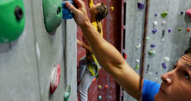 People Climbing Indoor Rock Wall with Colorful Handholds - Download Free Stock Images Pikwizard.com