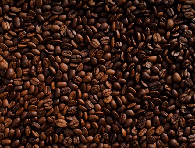 Close-up of roasted coffee beans background - Download Free Stock Photos Pikwizard.com
