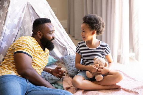 Father and Daughter Engaging in Creative Playtime at Home