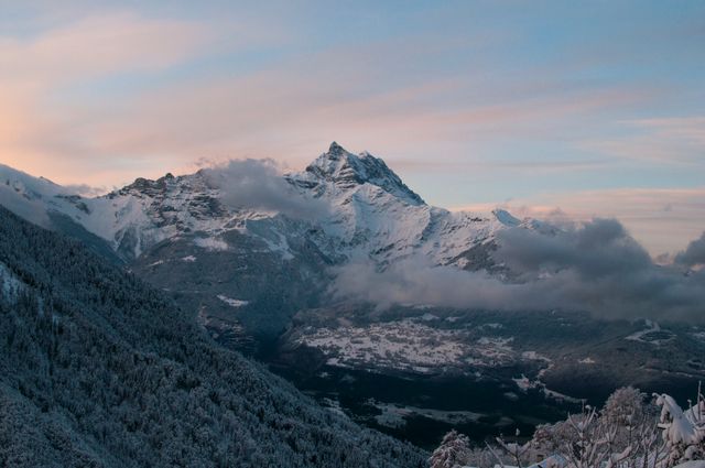 Snow-Covered Alpine Mountain Range at Sunset - Download Free Stock Photos Pikwizard.com