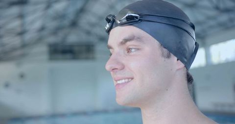 Confident Swimmer Preparing with Swim Cap and Goggles