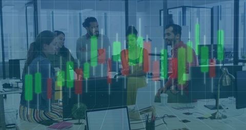 Diverse team collaborating around open-plan workstation with stock market candlestick overlay