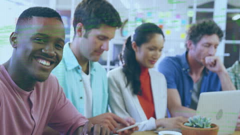 Diverse Multiracial Team Working on Digital Project in Modern Office