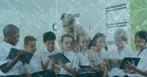 Schoolchildren engaged with tablets and overlay of math equations