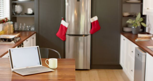 Modern Kitchen Decorated for Christmas with Laptop and Holiday Stockings - Download Free Stock Images Pikwizard.com