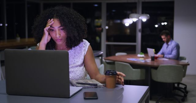 Tired Businesswoman With Laptop Working Late in Modern Office - Download Free Stock Images Pikwizard.com