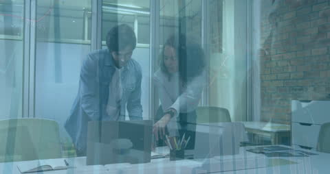 Collaborative Team Analyzing Financial Data on Laptop in Modern Office