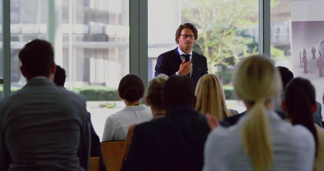 Businessman Presenting to Audience in Modern Conference Room - Download Free Stock Images Pikwizard.com