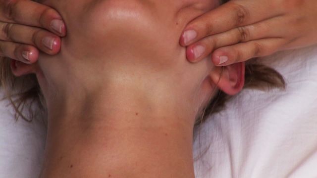 This video shows a close-up of a woman receiving a relaxing facial massage. This type of image is ideal for promoting spa services, wellness centers, beauty treatments, and skincare products. It conveys calmness, self-care, and professional beauty services.