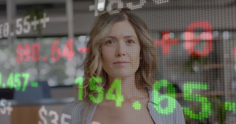 Caucasian Businesswoman Engaged with Stock Market Data Display
