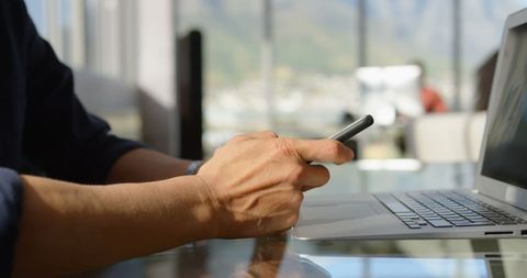 Businesswoman Using Mobile While Working at Desk in Office - Download Free Stock Images Pikwizard.com