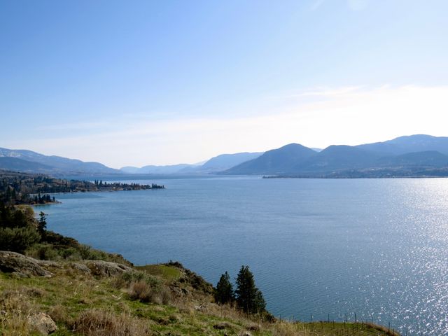 This serene image of a mountain lake and its calm waters reflecting a clear blue sky suggests tranquility and peace. Perfect for travel websites, nature tour companies, and relaxation or wellness marketing materials. It can also be used in environmental blogs, magazines, and articles highlighting serene outdoor destinations.