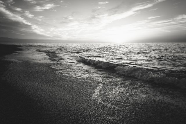 Monochrome Sunset Over Calm Ocean Waves - Download Free Stock Photos Pikwizard.com