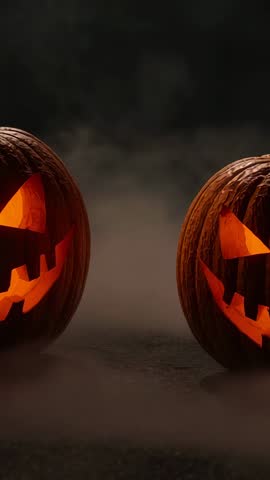 Pulsing glow between two jack-o'-lanterns stirring fog and drifting smoke vertical Halloween video