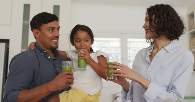 Happy Family Drinking Healthy Green Smoothies Together in Kitchen - Download Free Stock Images Pikwizard.com