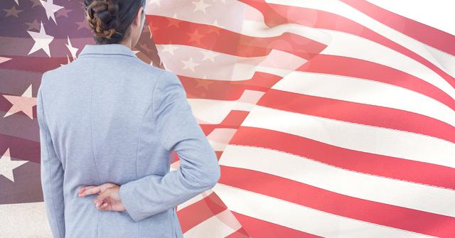 Businesswoman crossing fingers behind her back in front of an American flag. Useful for concepts related to deception, politics, patriotism, and trust issues in a corporate or national context. Ideal for articles, blogs, and presentations on ethics, business practices, and political commentary.