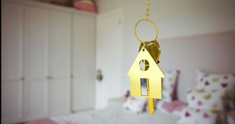 Gold House Keyring Hanging in Cozy Child's Bedroom