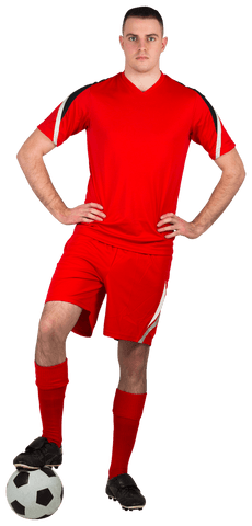 Confident football player in red uniform with soccer ball transparent background