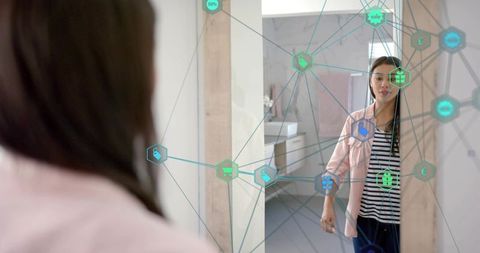 Young woman using augmented-reality mirror for smart shopping and personal care