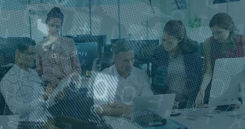 Collaborative Team Analyzing Data in Tech-Driven Workspace