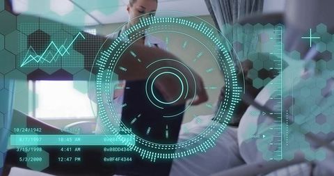 Clinician examining patient wearing hospital gown with teal hud diagnostics overlay