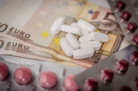 Euro Banknotes and Pills Conceptualizing Healthcare Costs