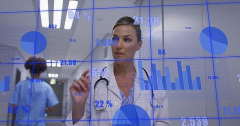 Female Doctor Interacting with Digital Healthcare Data Visualization in Hospital Corridor