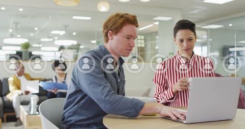 Colleagues Discussing Work with Digital Interface Overlay