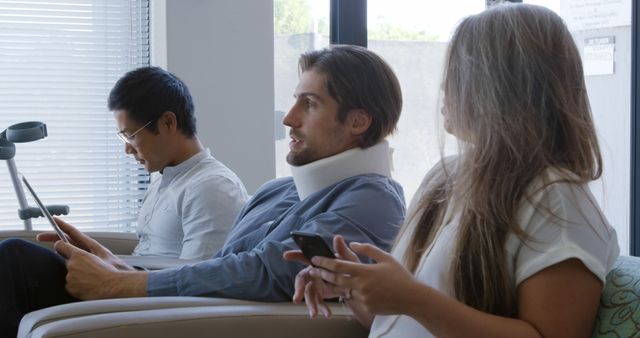 Three People Waiting with Phone and Tablet in Hospital Waiting Room - Download Free Stock Images Pikwizard.com