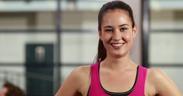 Smiling Young Woman at Gym - Download Free Stock Images Pikwizard.com