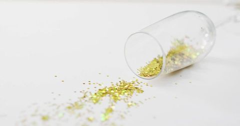 Champagne Glass Tipped with Glittering Confetti Celebrating Elegance