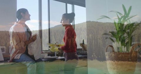 Mother and daughter bonding in bright kitchen with nature