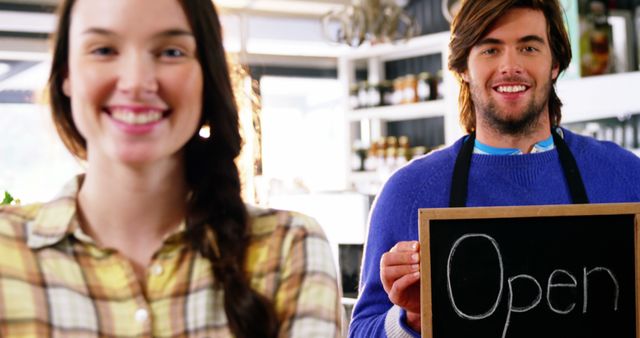 Friendly Cafe Staff Holding Open Sign - Download Free Stock Images Pikwizard.com