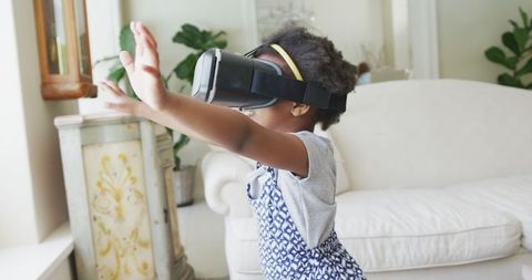 Joyful African American Girl Engaging with Virtual Reality