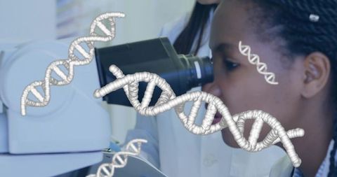 Scientist examining dna sequences through microscope