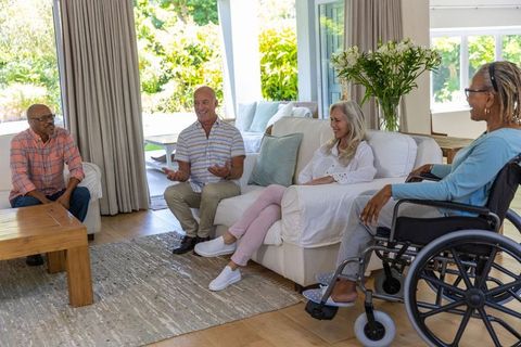 Senior Friends Gathering in Cozy Living Room Setting