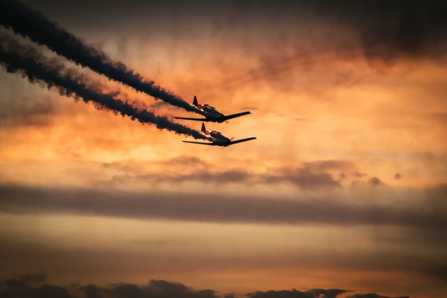 2 Jet Planes on Sky Under Orange Clouds - Download Free Stock Photos Pikwizard.com